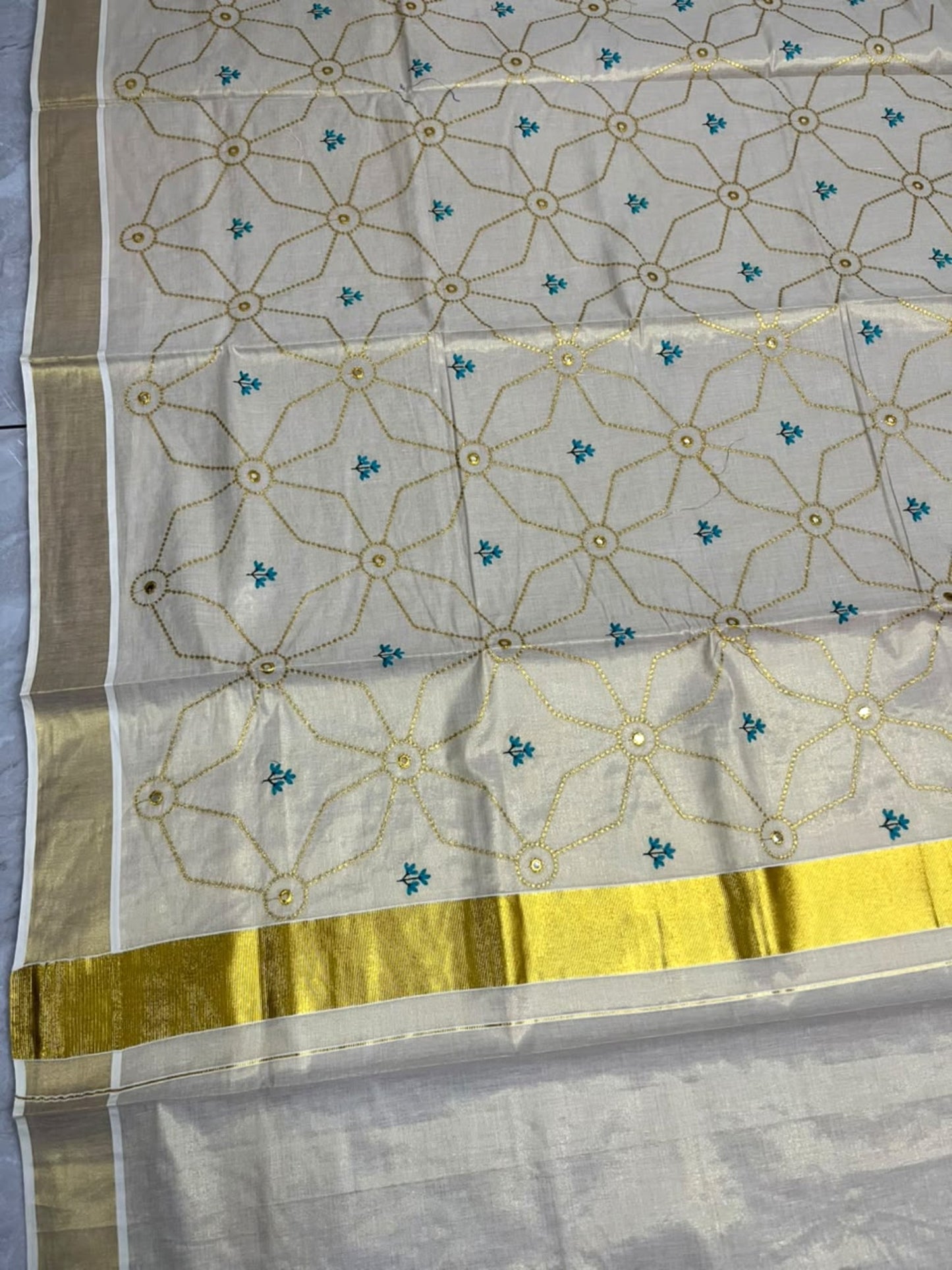 Southloom Kerala Tissue Kasavu Saree with Floral Embroidery Work on Body in Blue