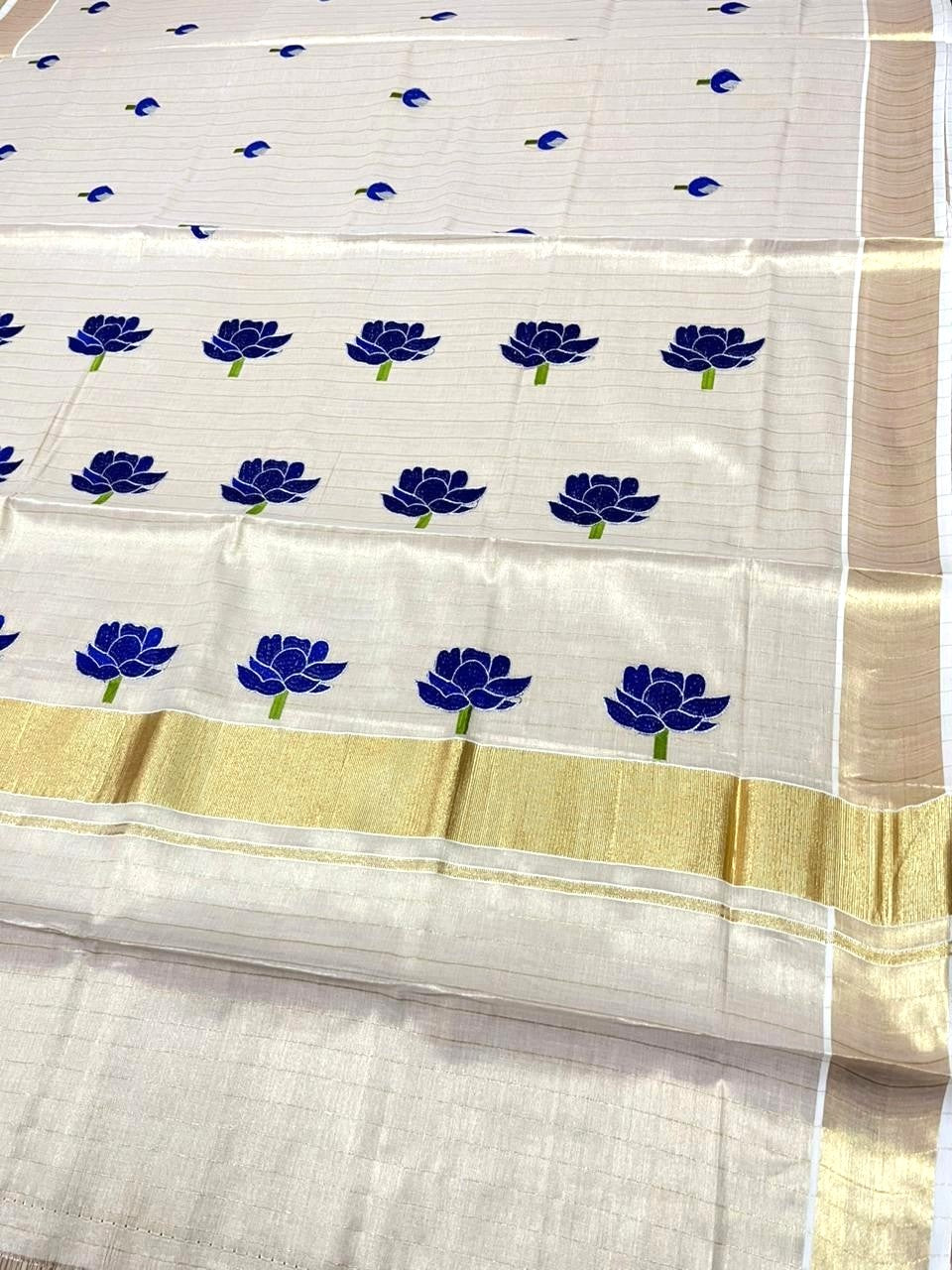 Southloom Kerala Tissue Lotus Blue Embroidery on the body with Gold Kasavu