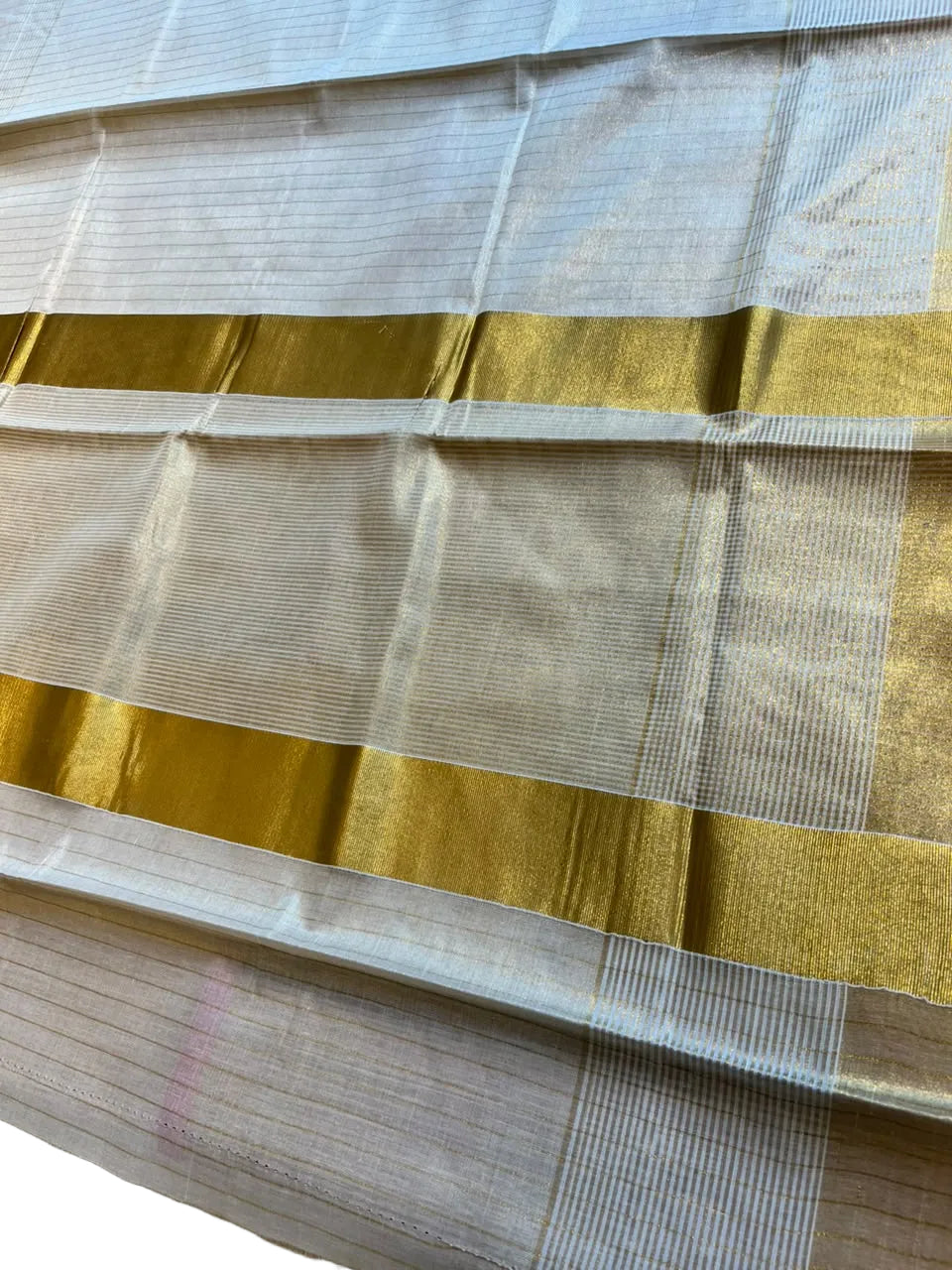 Southloom Kerala Tissue Saree With Lines On The Body With Kasavu Borders