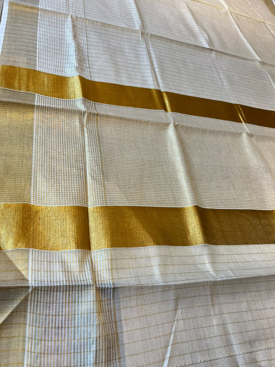 Southloom Kerala Tissue Saree With Lines On The Body With Kasavu Borders