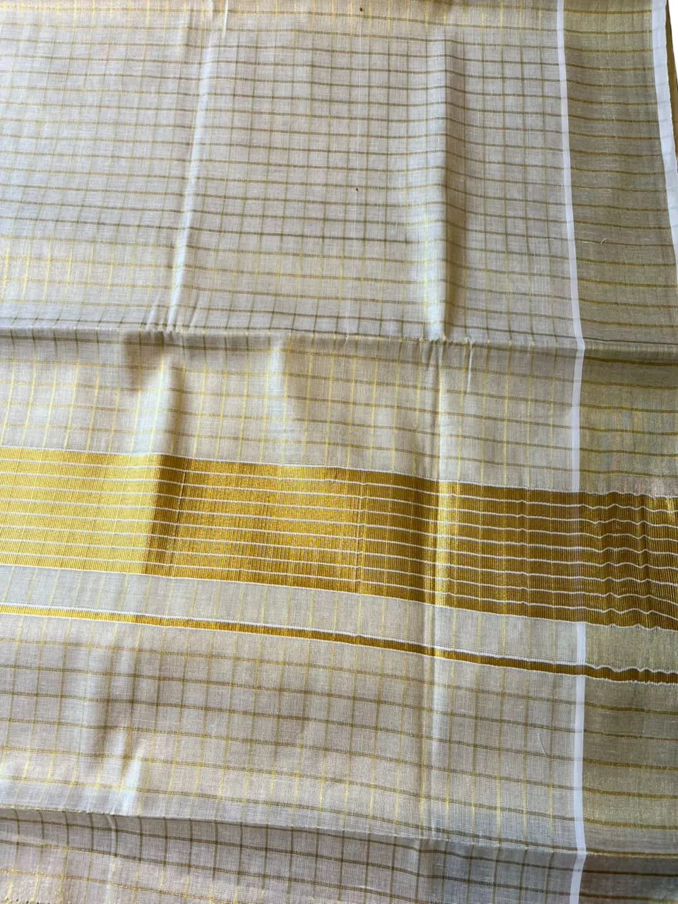 Kerala Tissue Kasavu Saree With Check Designs On The Body