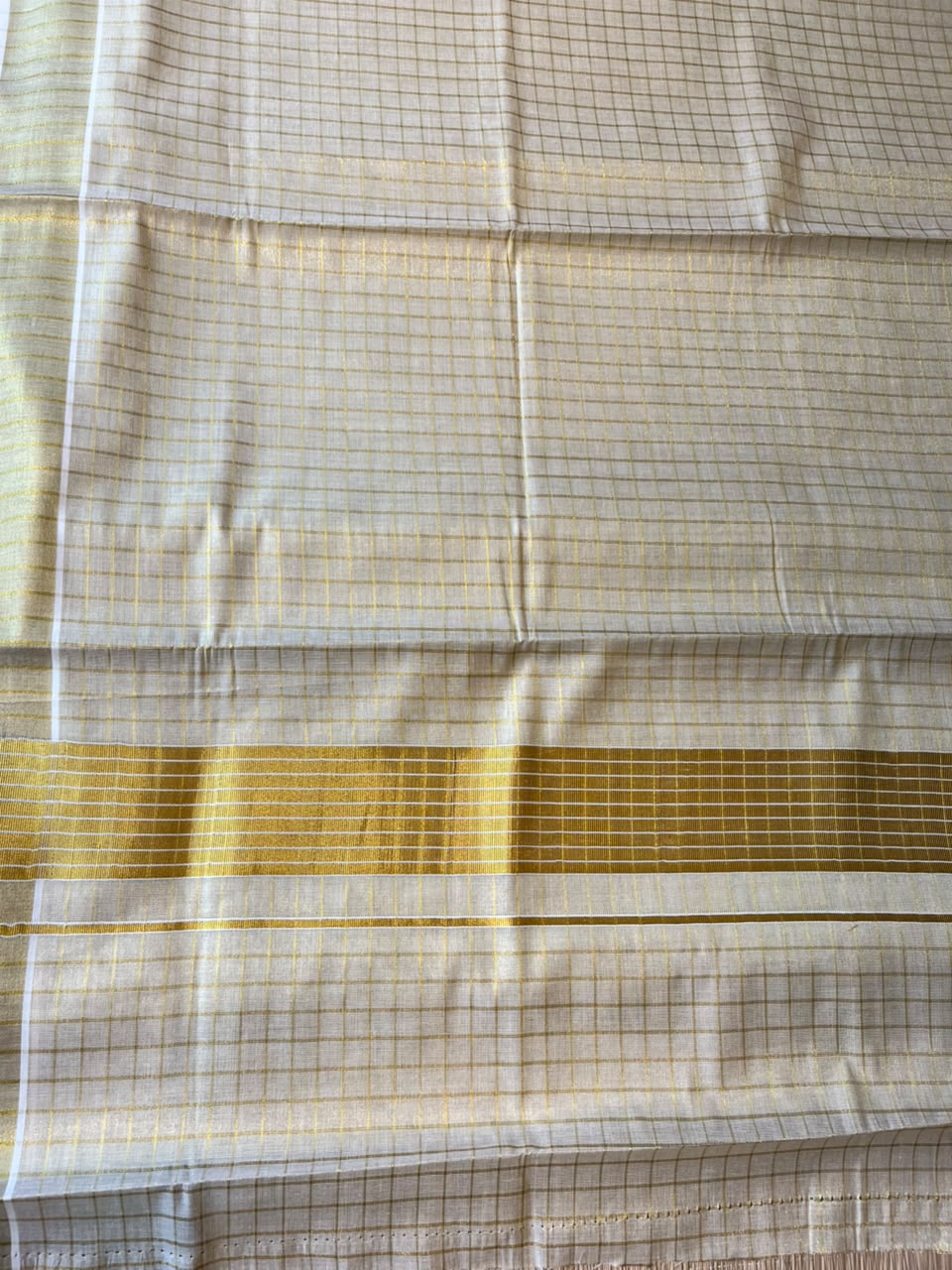 Kerala Tissue Kasavu Saree With Check Designs On The Body