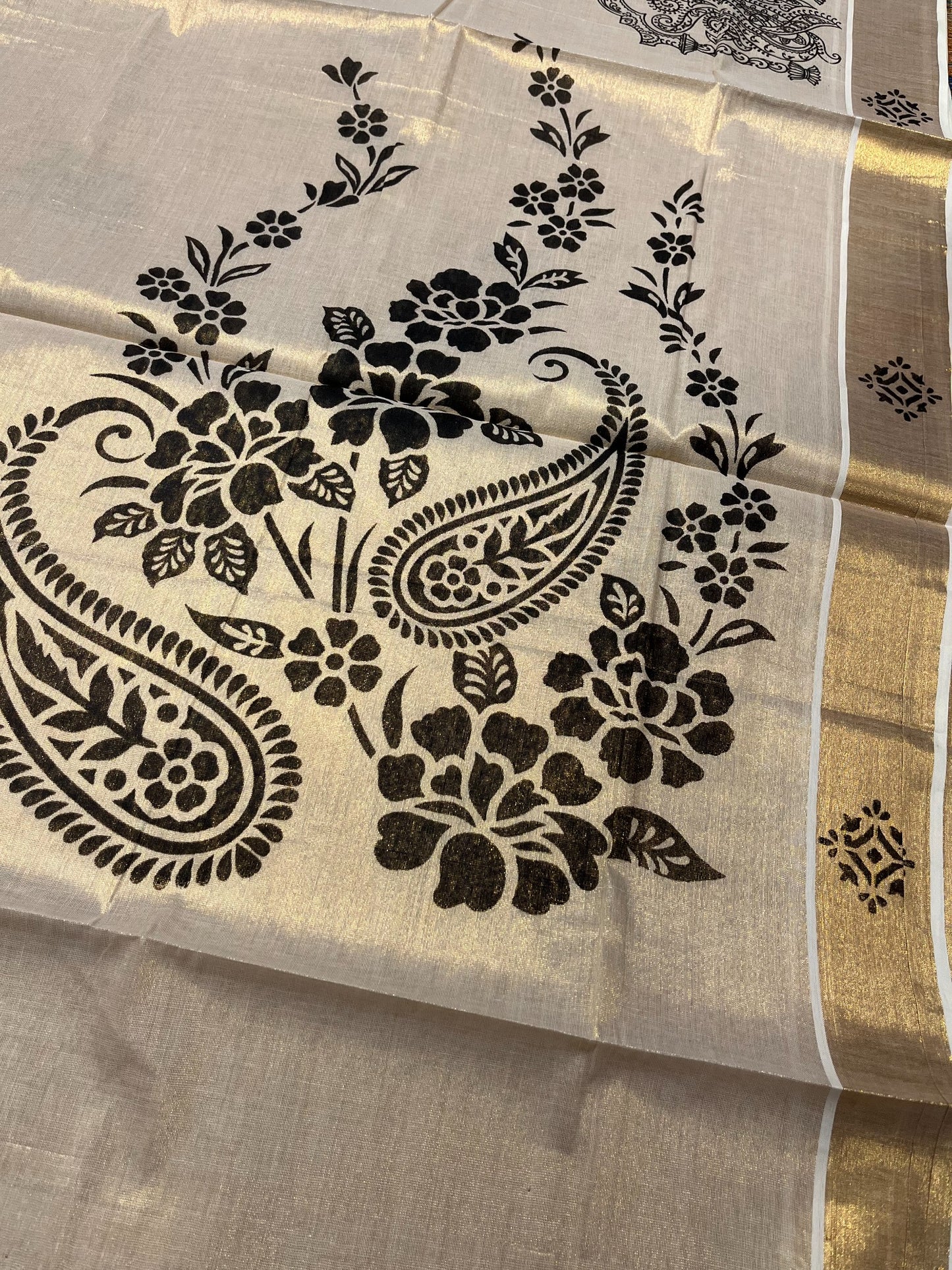 Kerala Tissue Kasavu Saree with Black Floral Block Printed Designs