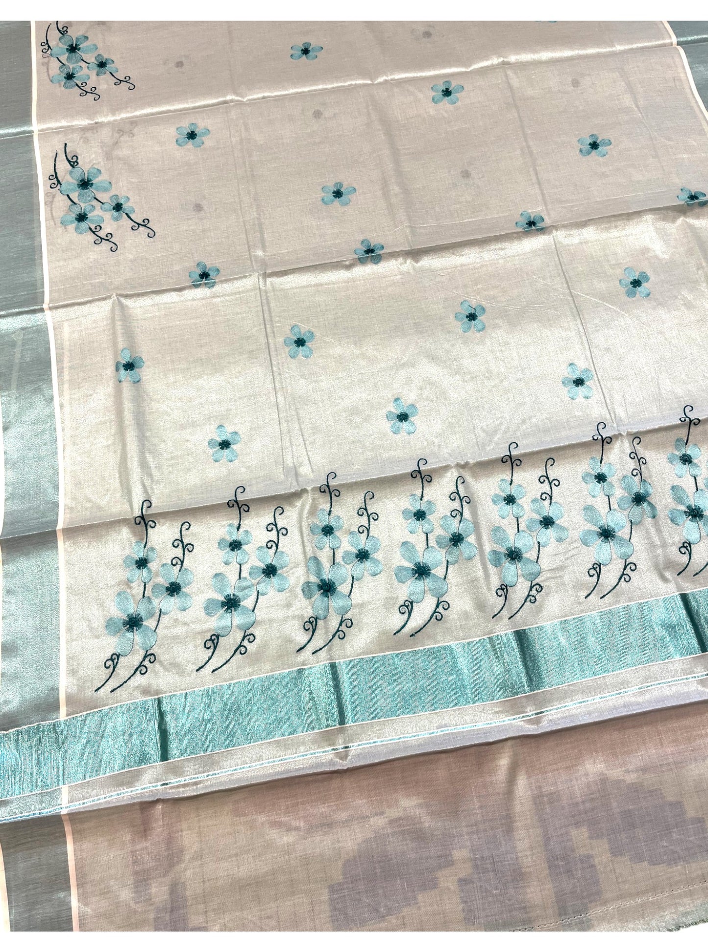 Southloom Kerala Tissue Kasavu Saree with Blue Floral Embroidery on Body and Border