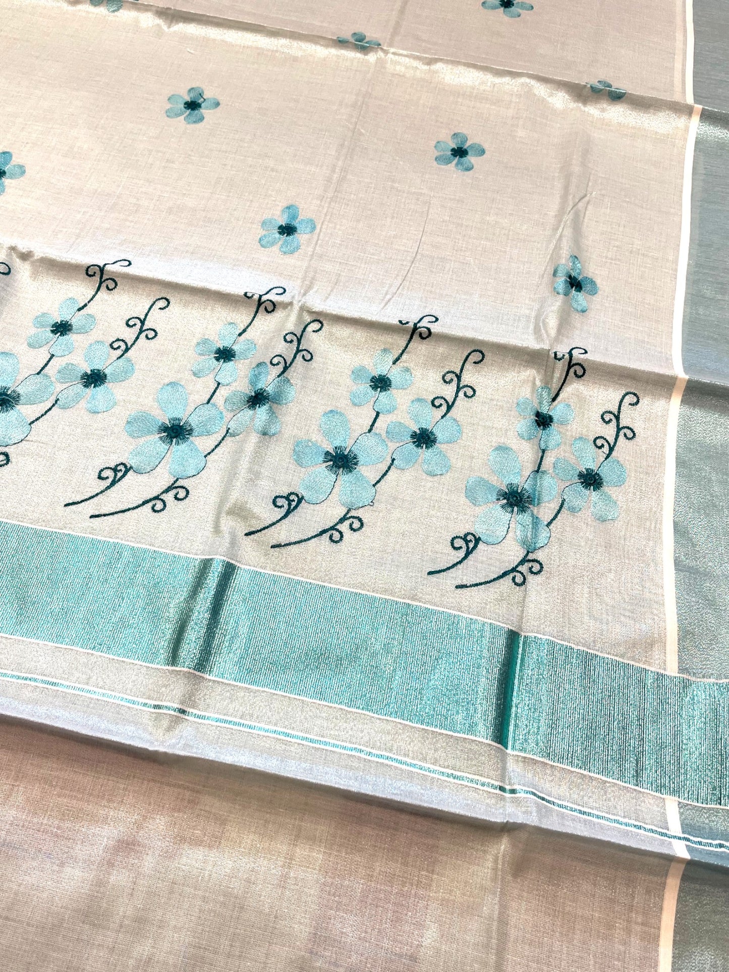 Southloom Kerala Tissue Kasavu Saree with Blue Floral Embroidery on Body and Border