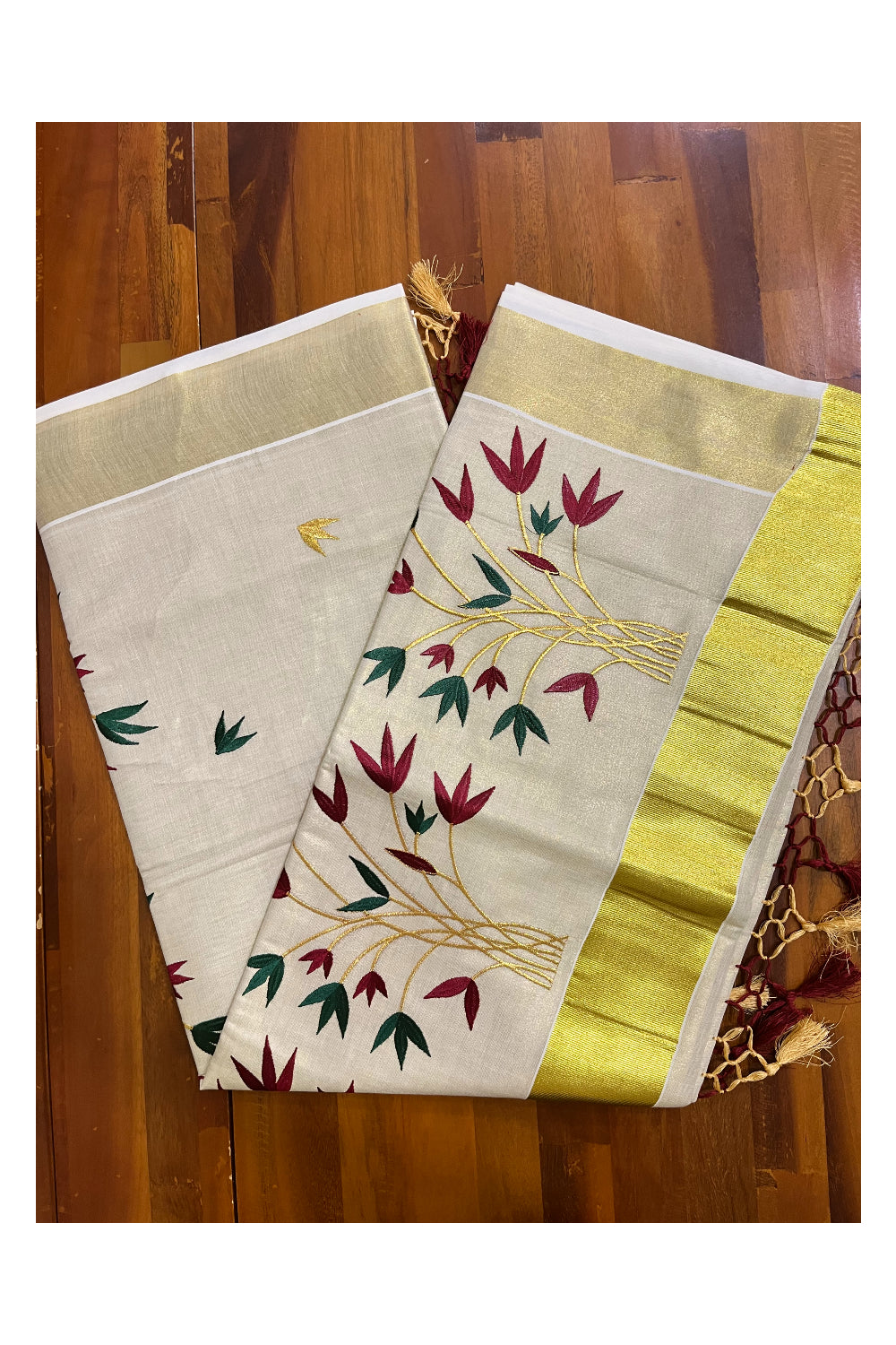 Kerala Tissue Kasavu Saree with Red And Green Floral Embroidery Works