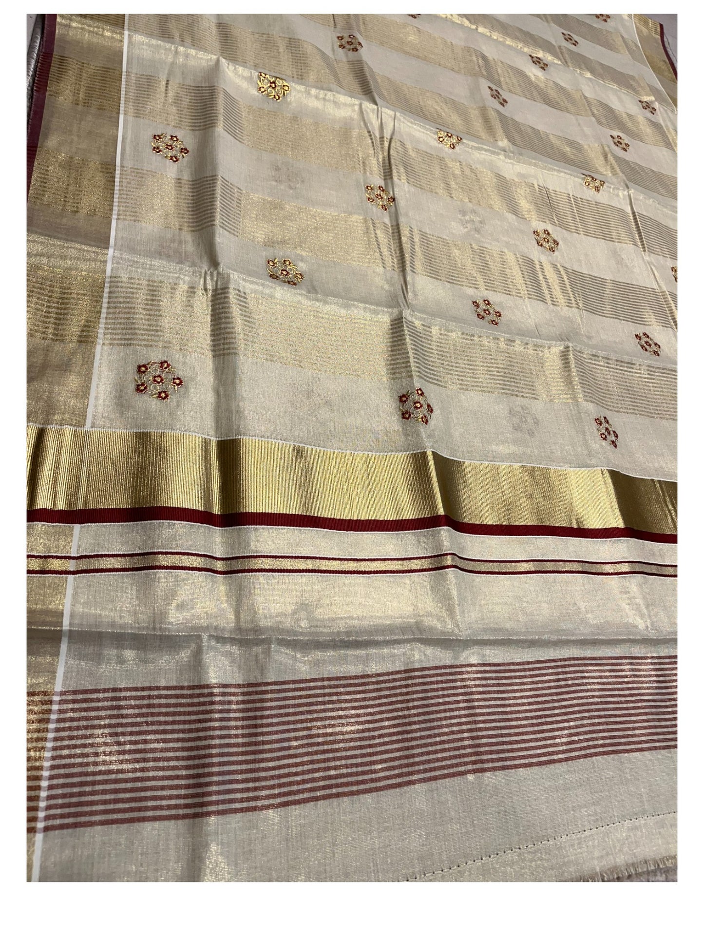 Kerala Tissue Kasavu Lines Saree with Golden And Maroon Embroidery Works