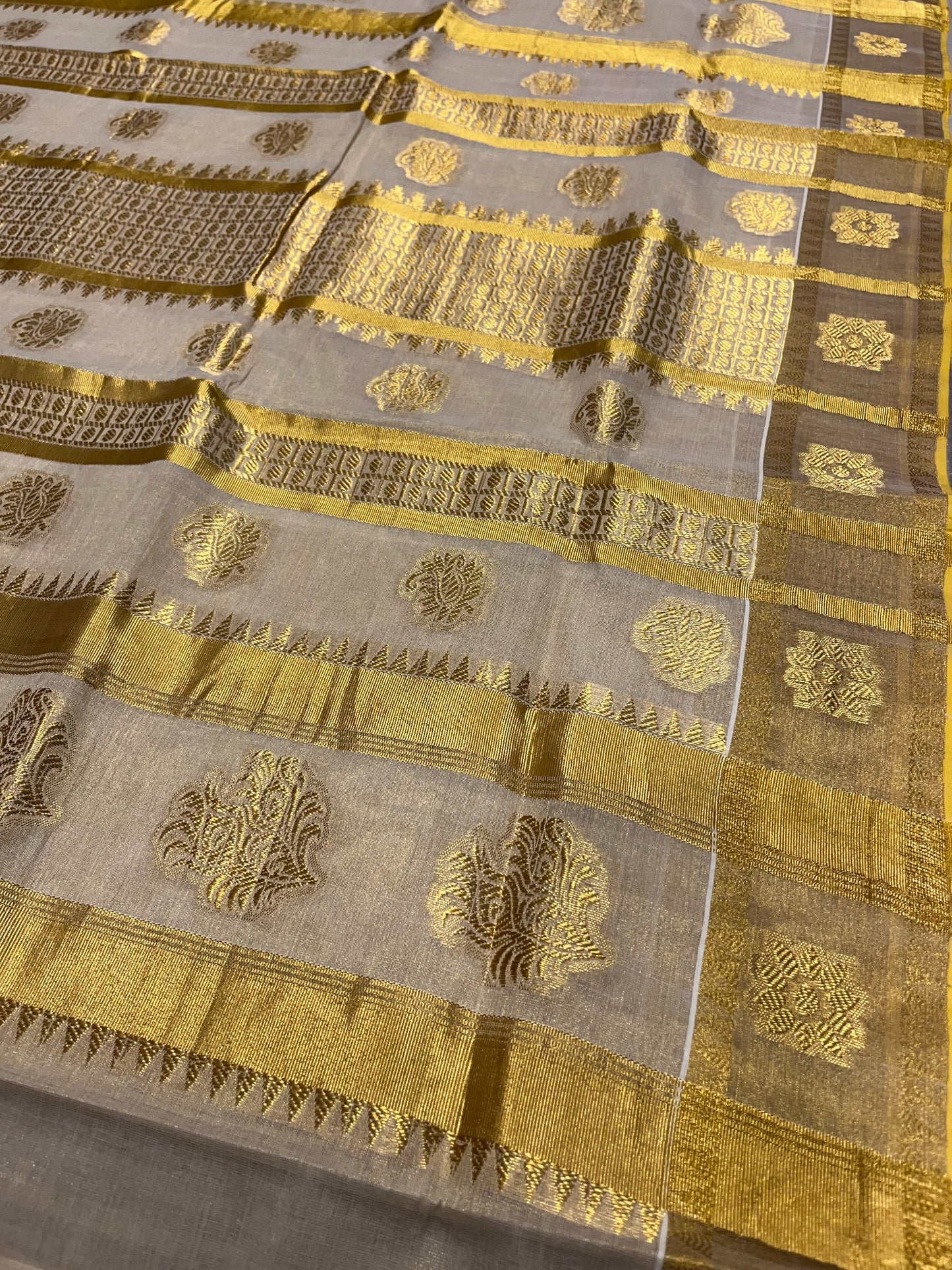 Southloom Tissue Kasavu Replica Saree with Woven Butta Works Across Body and Temple Border