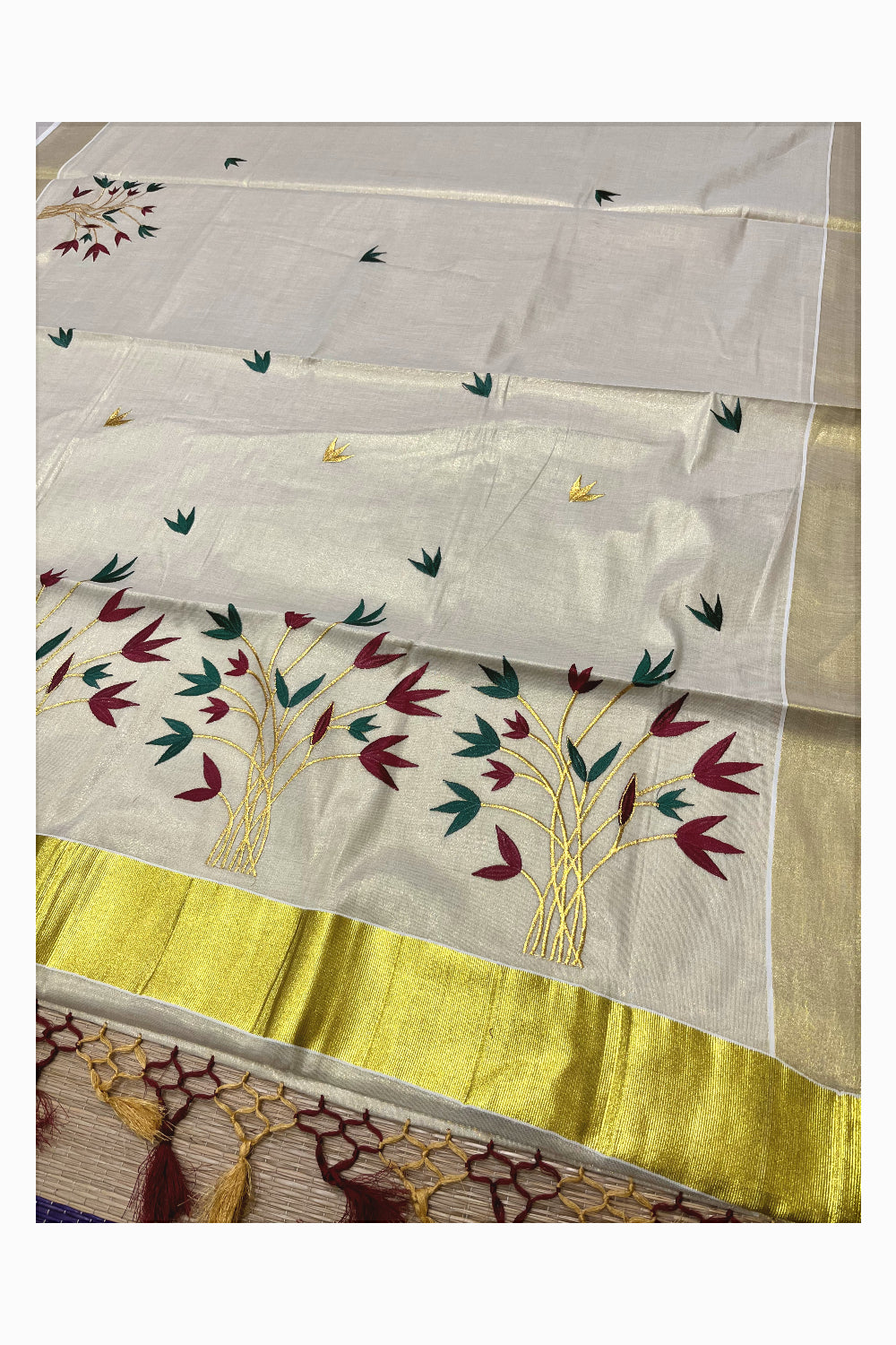 Kerala Tissue Kasavu Saree with Red And Green Floral Embroidery Works