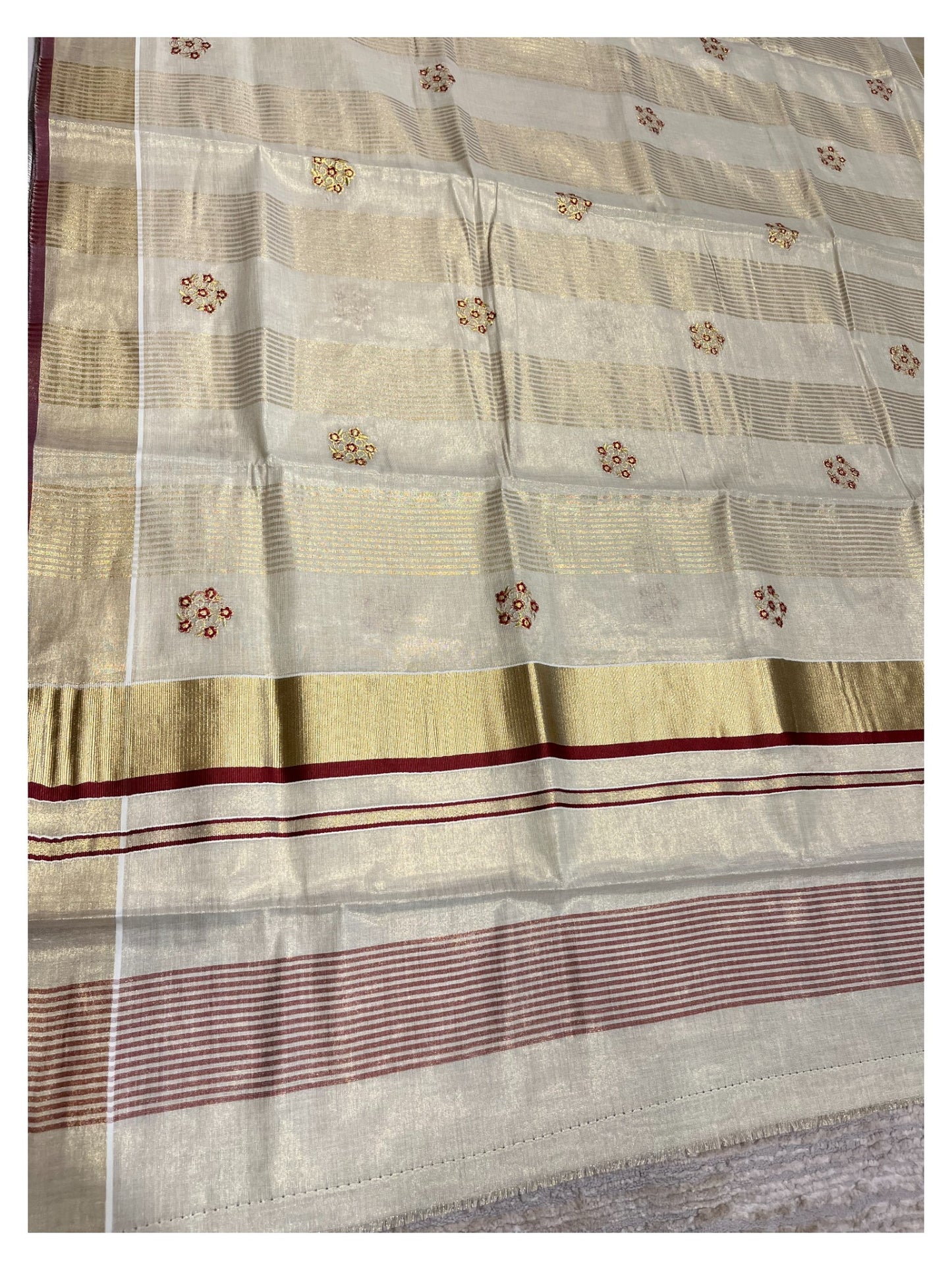 Kerala Tissue Kasavu Lines Saree with Golden And Maroon Embroidery Works