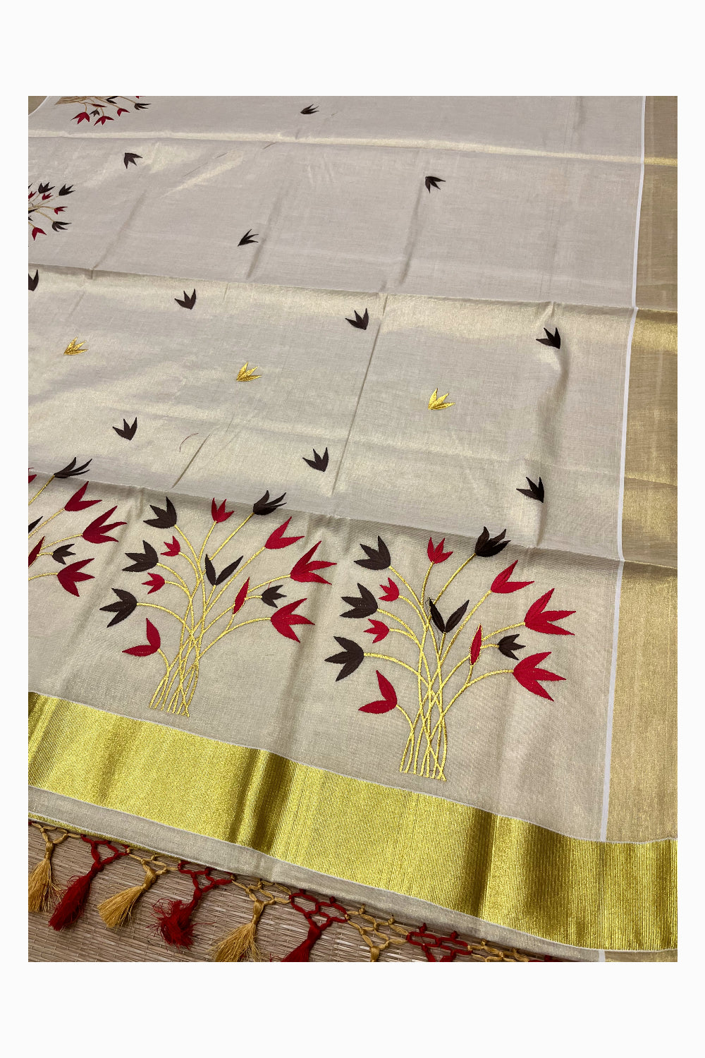 Kerala Tissue Kasavu Saree with Red And Brown Floral Embroidery Works