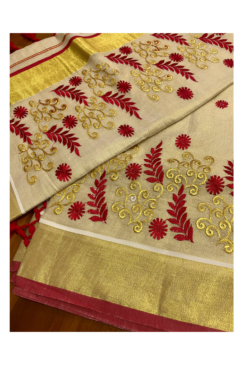 Kerala Tissue Kasavu Heavy Work Saree with Golden and Red Leaf Embroidery Design