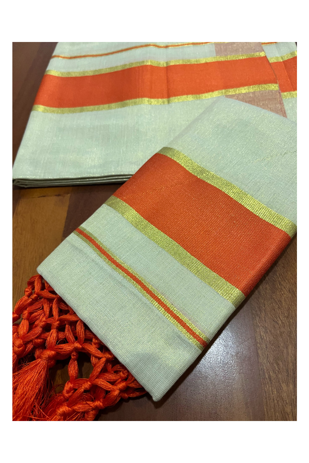 Kerala Tissue Kasavu Set Mundu (Mundum Neriyathum) with Orange Kara and Tassels on Pallu 2.50 Mtrs