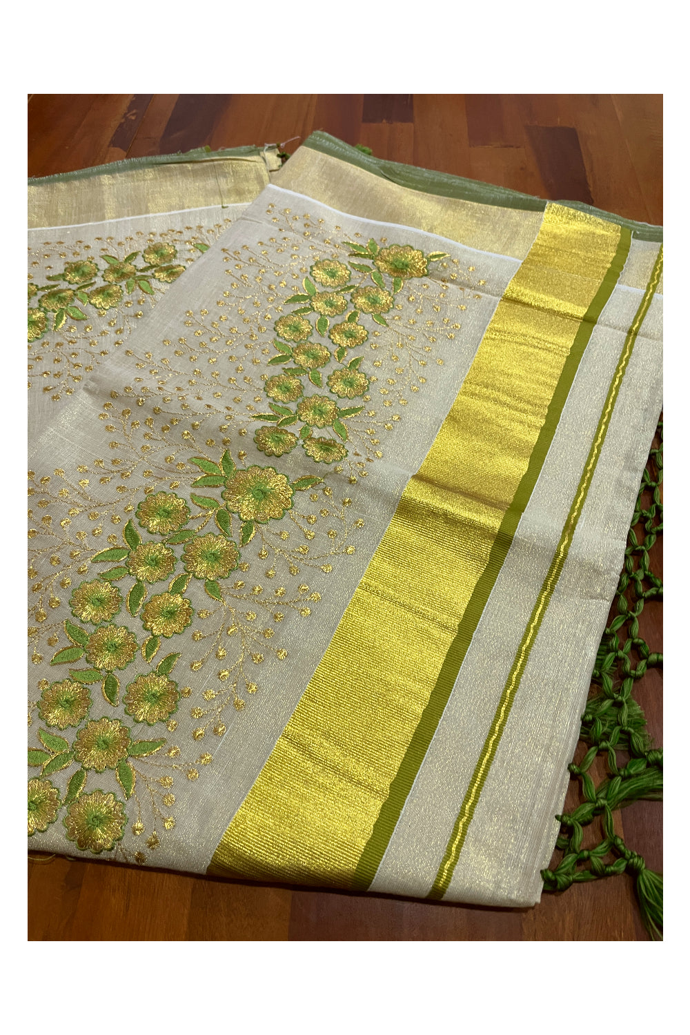 Kerala Tissue Kasavu Heavy Work Saree with Golden and Green Floral Embroidery Design