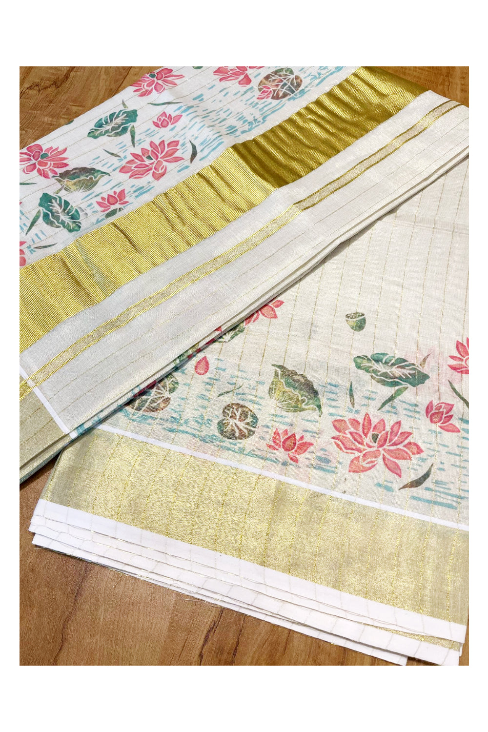 Kerala Tissue Kasavu Lines Saree with Lotus Floral Prints On Border