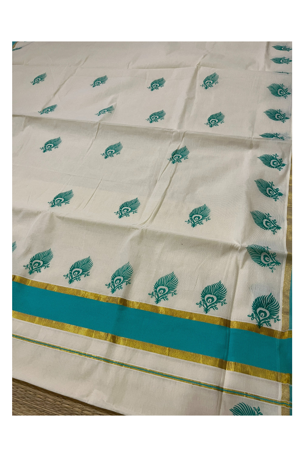 Pure Cotton Kerala Saree with Turquoise Feather Block Prints and Kasavu Border