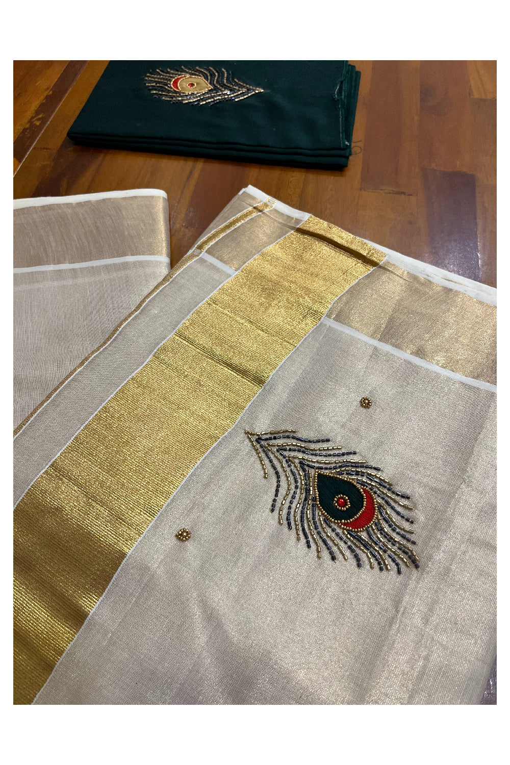 Kerala Tissue Kasavu Saree with Feather Themed Bead Work Design and Green Blouse Piece (Vishu 2024 Collection)