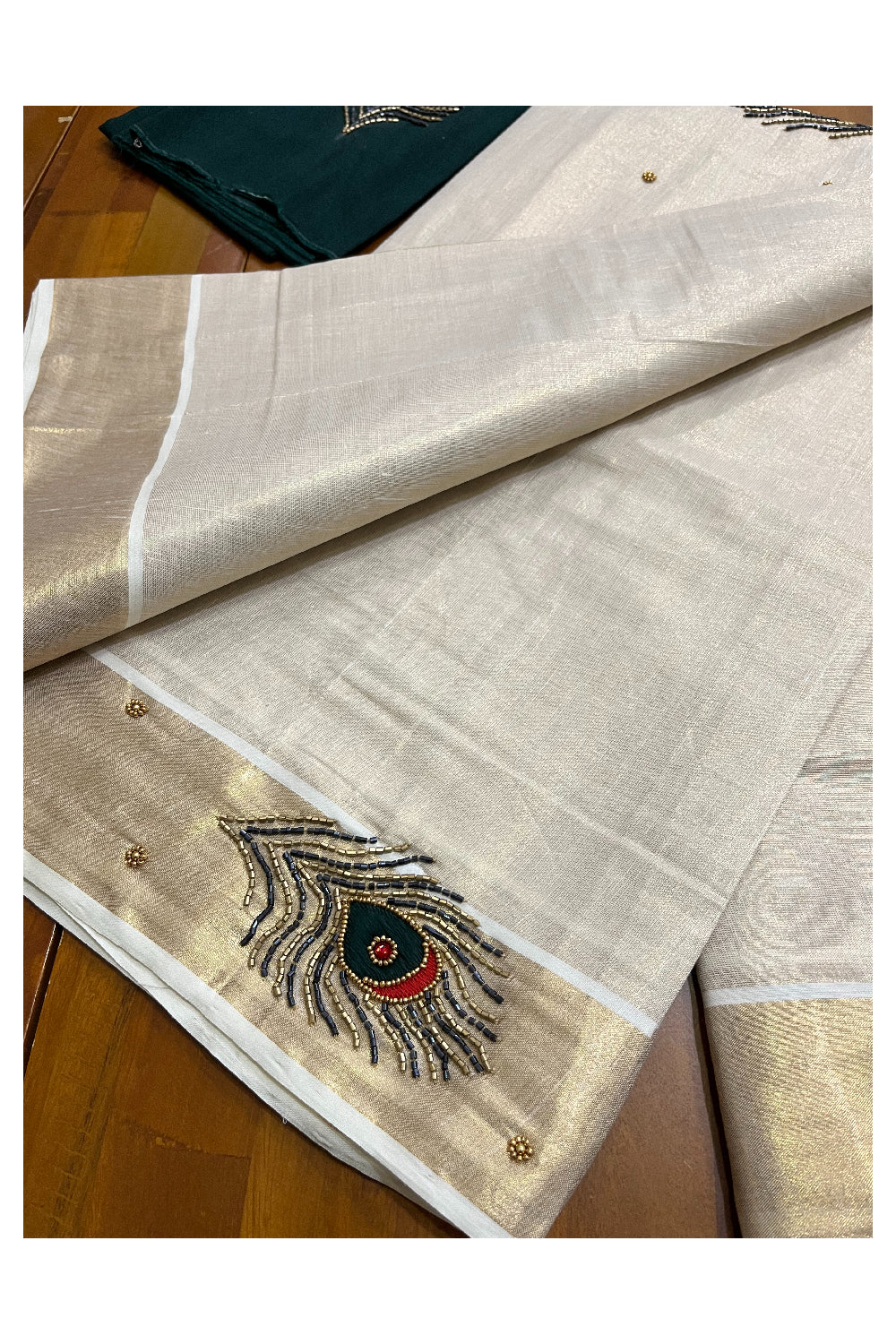 Kerala Tissue Kasavu Saree with Feather Themed Bead Work Design and Green Blouse Piece (Vishu 2024 Collection)