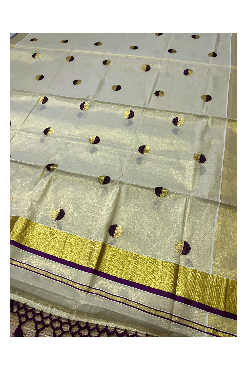 Kerala Tissue Kasavu Saree with Purple Semi Polka Woven Designs and Tassels Works