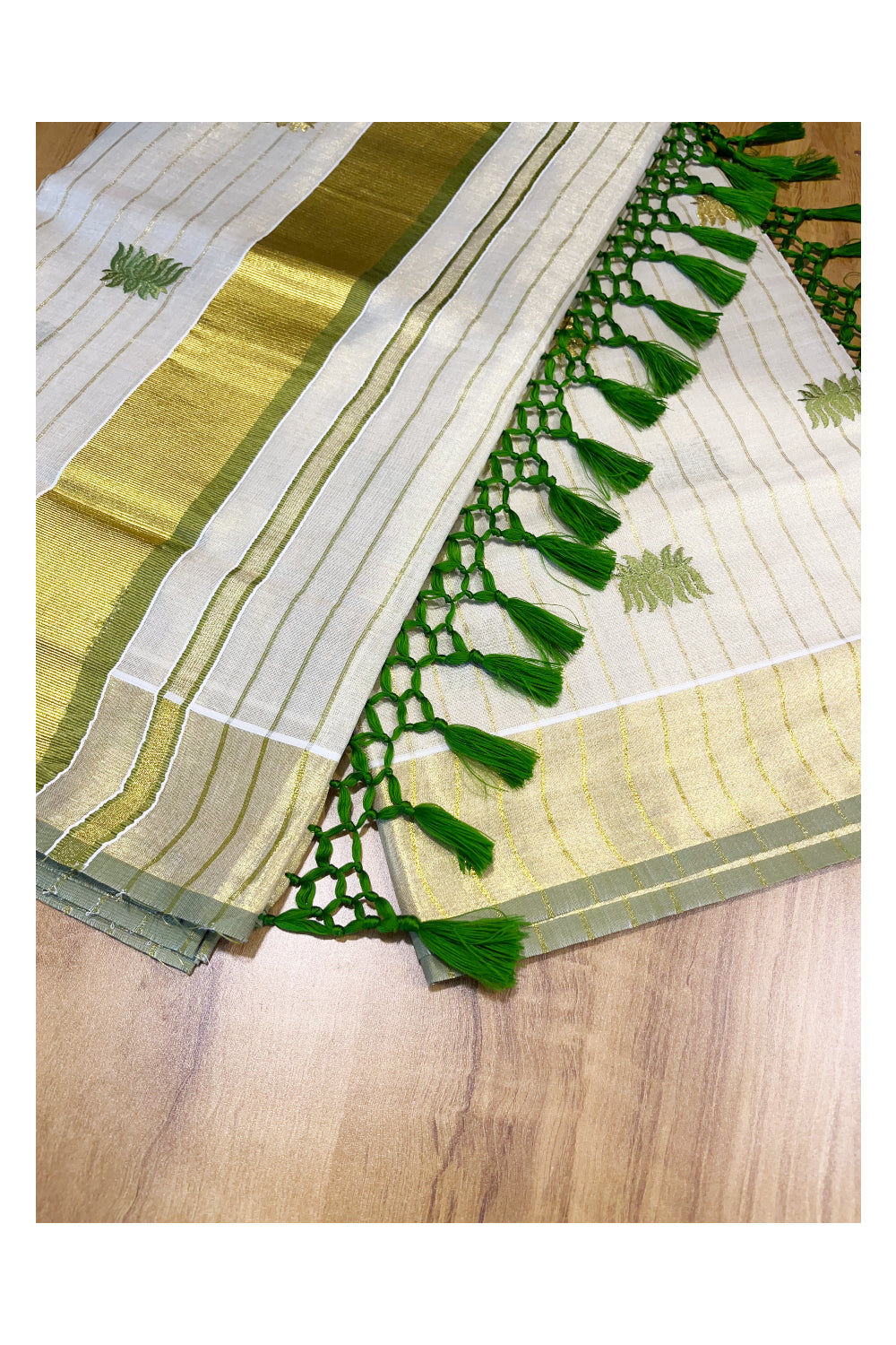 Kerala Tissue Kasavu Lines Saree with Olive Green And Golden Lotus Embroidery Works