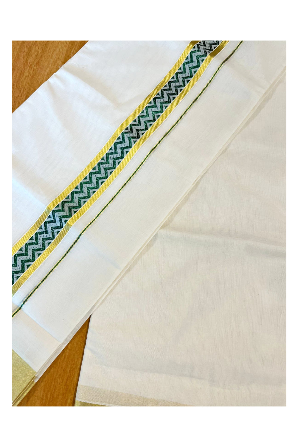 Southloom Premium Handloom Pure Cotton Mundu with Green and Kasavu Woven Border