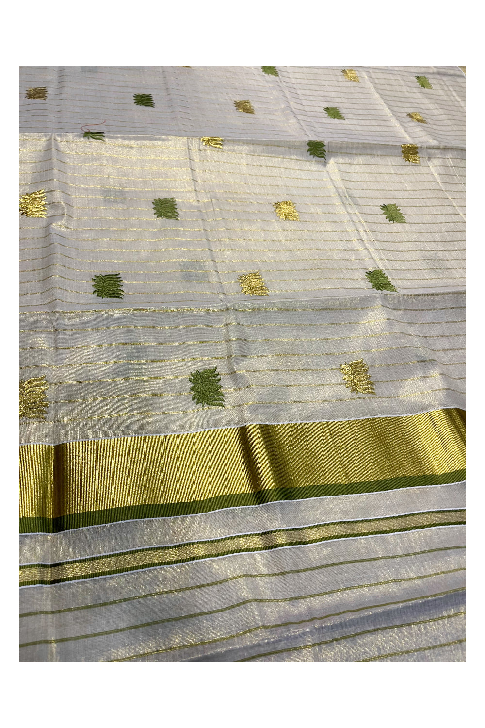 Kerala Tissue Kasavu Lines Saree with Olive Green And Golden Lotus Embroidery Works