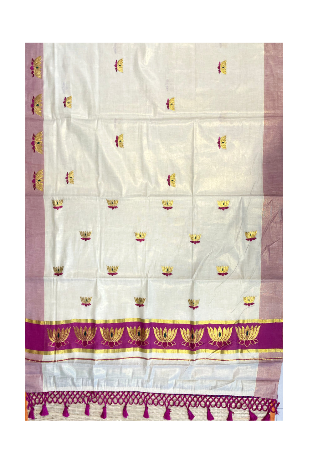 Southloom Kerala Tissue Kasavu Saree with Magenta And Golden Lotus Embroidary Works on Body