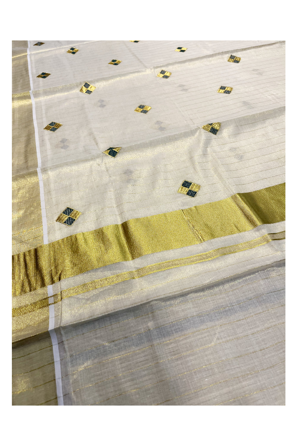 Kerala Tissue Kasavu Stripes Saree with Green and Golden Diagonal Floral Embroidery Design on Body