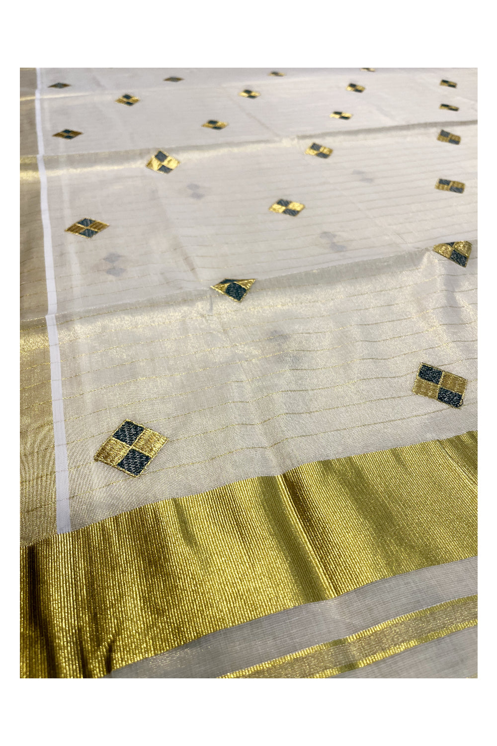 Kerala Tissue Kasavu Stripes Saree with Green and Golden Diagonal Floral Embroidery Design on Body