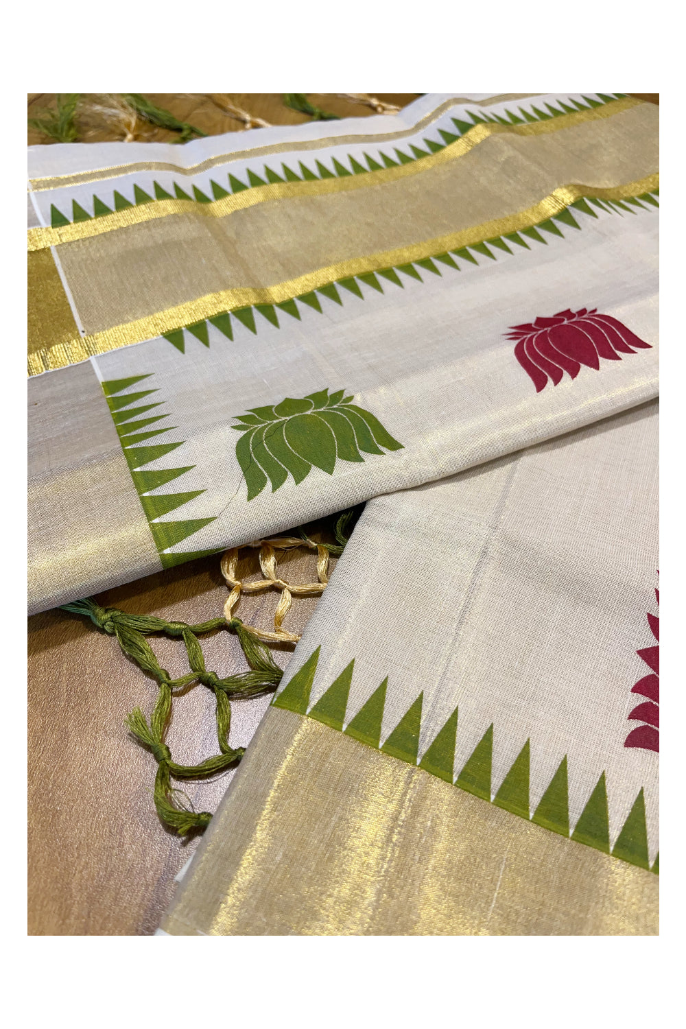 Kerala Tissue Kasavu Saree with Green and Maroon Lotus Woven Designs