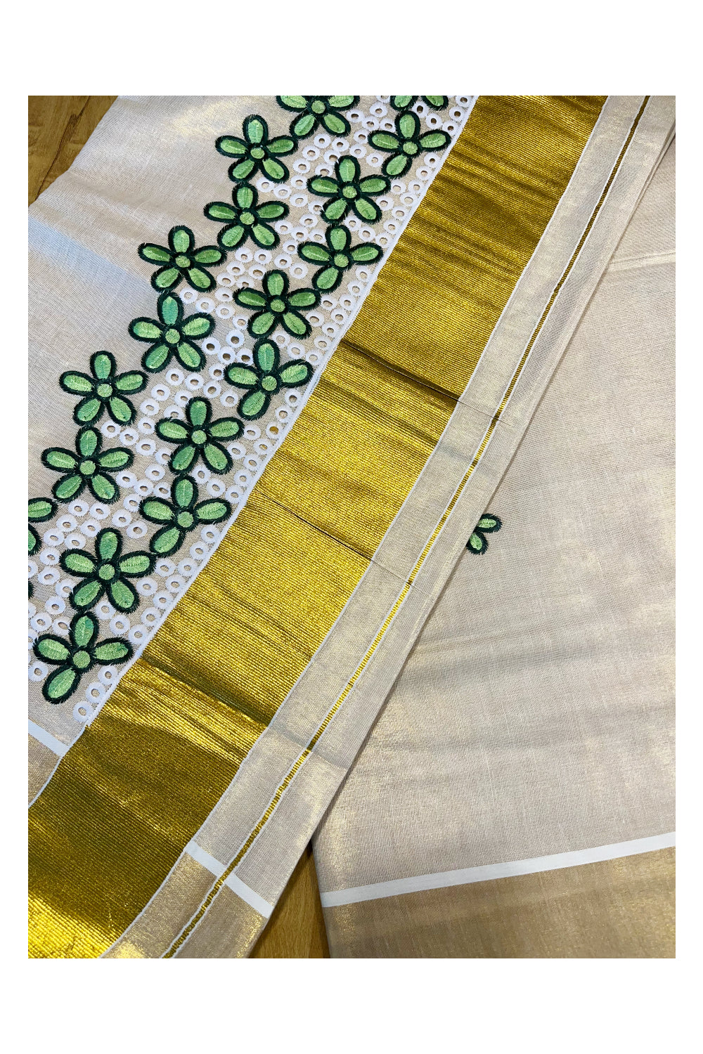 Kerala Tissue Kasavu Saree with Green Floral Embroidery Works