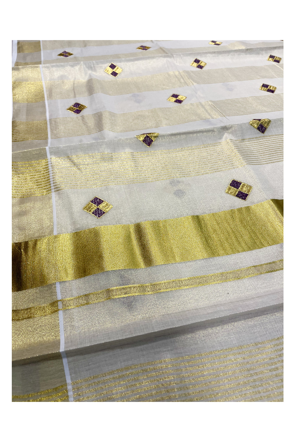 Kerala Tissue Kasavu Stripes Saree with Violet and Golden Diagonal Floral Embroidery Design on Body