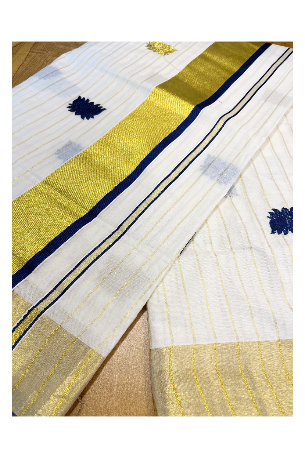 Kerala Cotton Kasavu Lines Saree with Blue And Golden Lotus Embroidery Works