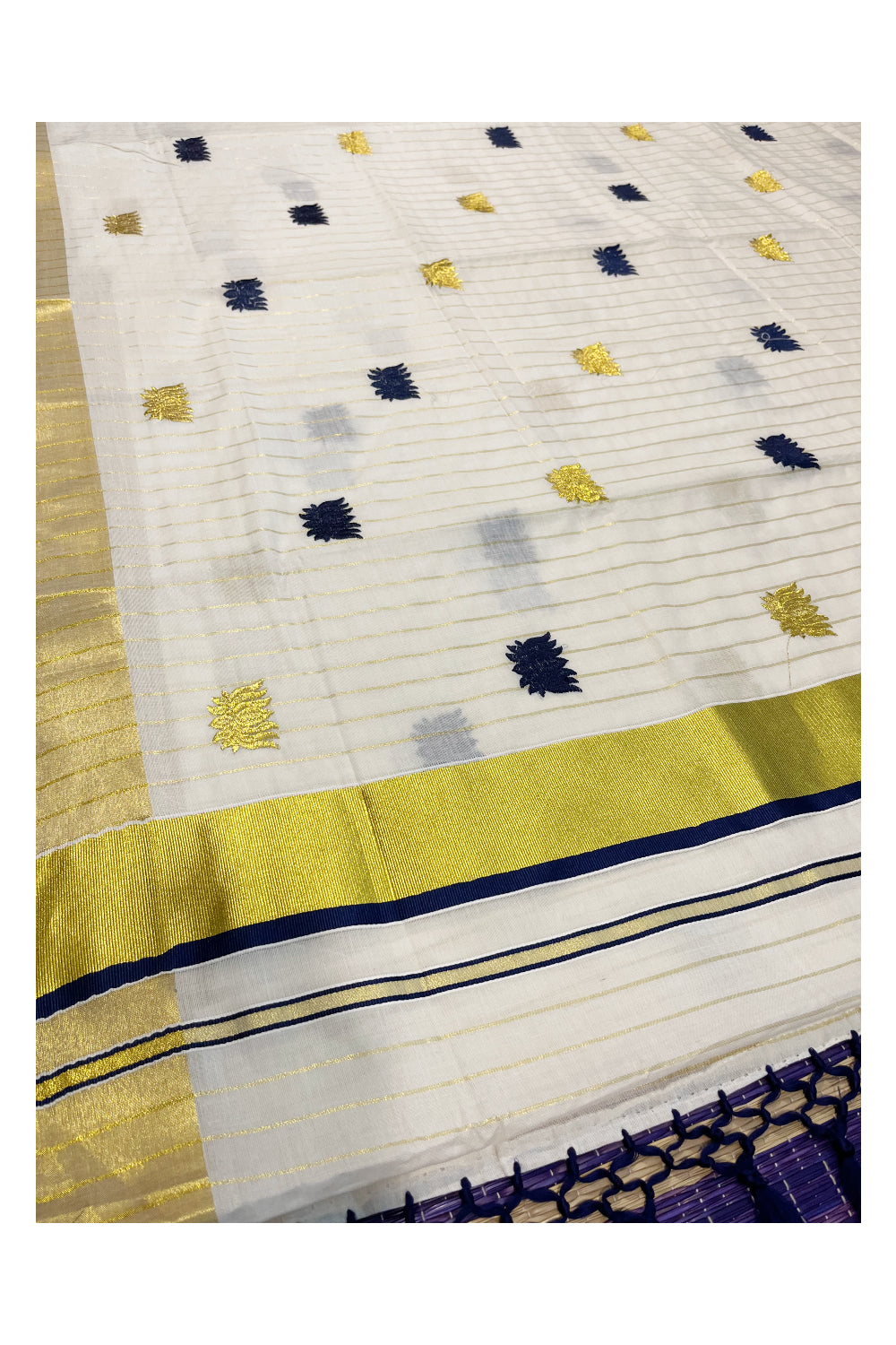 Kerala Cotton Kasavu Lines Saree with Blue And Golden Lotus Embroidery Works