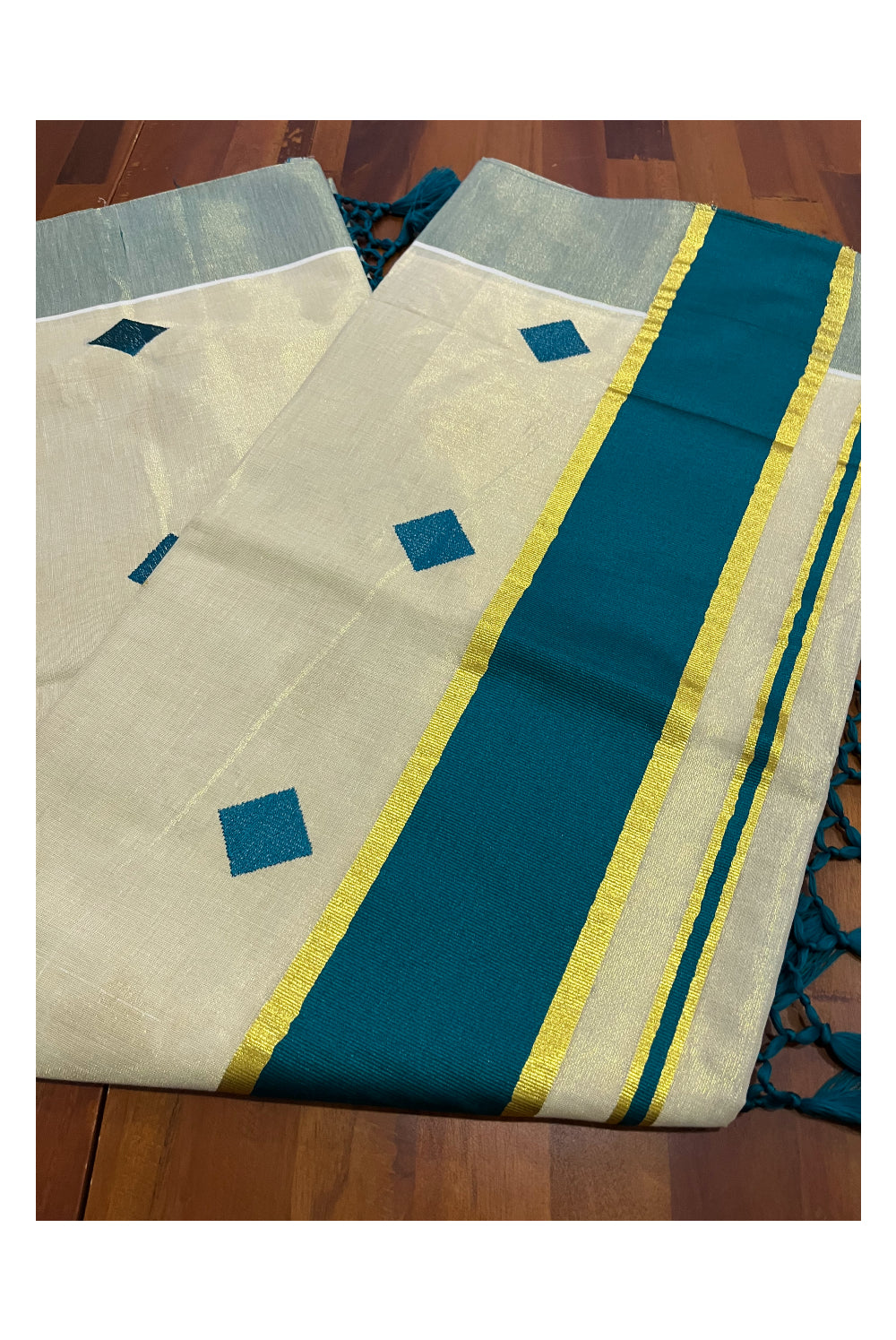 Kerala Tissue Kasavu Saree with Green Woven Butta Designs and Tassels Works