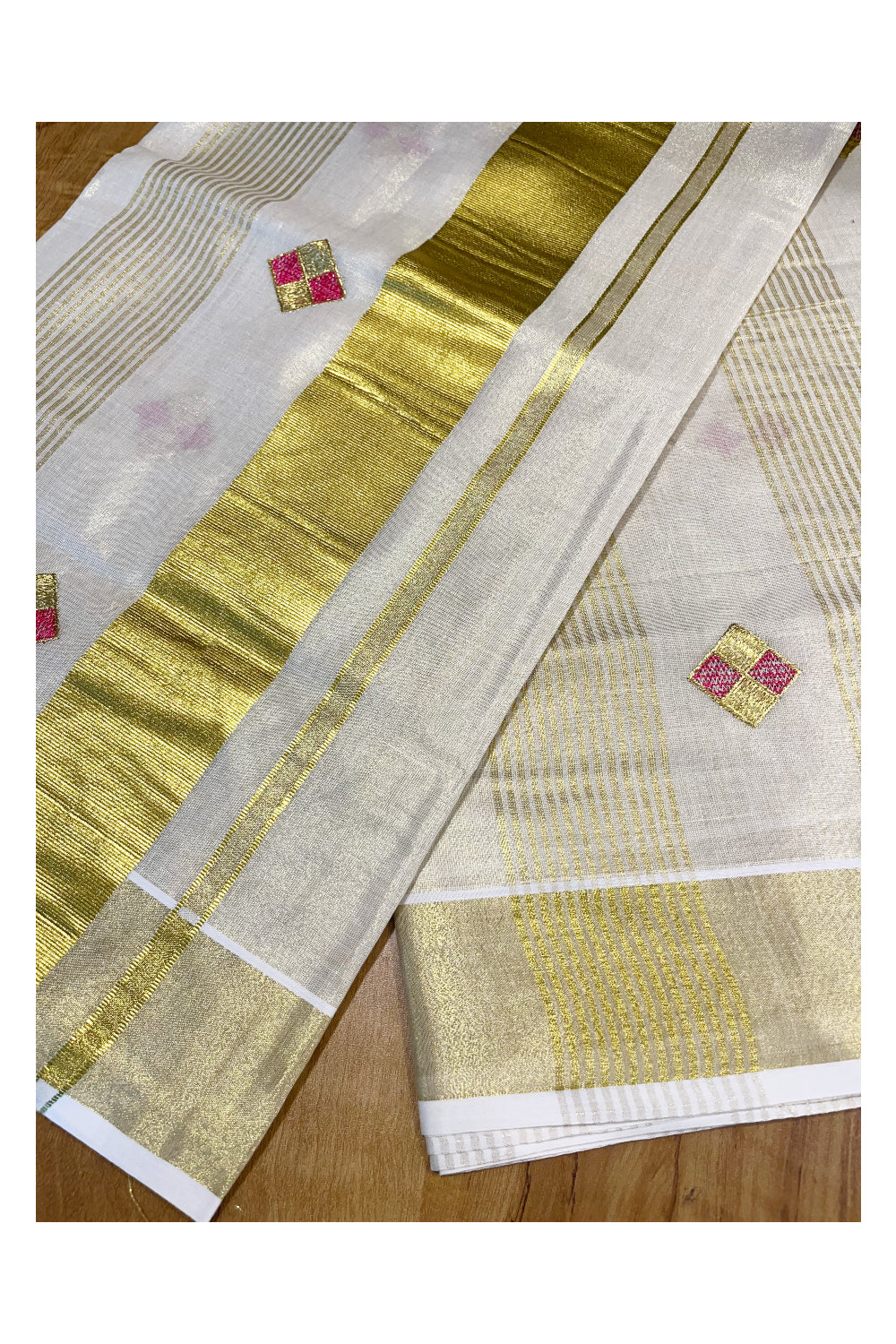 Kerala Tissue Kasavu Stripes Saree with Pink and Golden Diagonal Floral Embroidery Design on Body