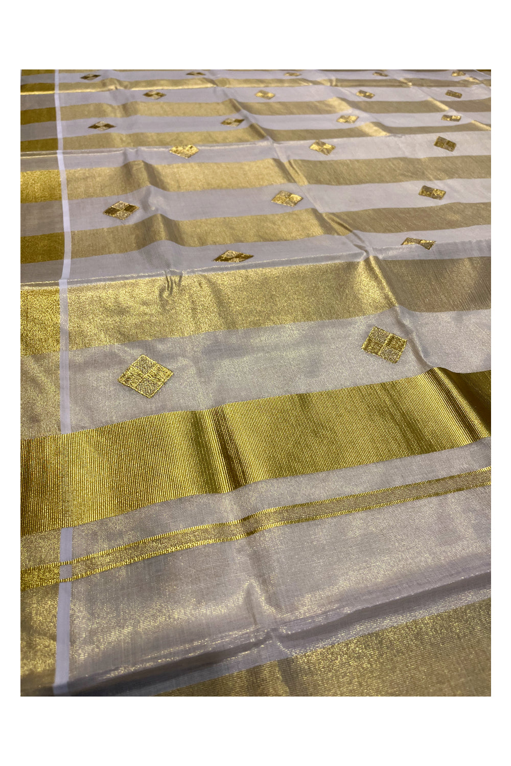 Kerala Tissue Kasavu Lines Saree with Golden Diagonal Woven Embroidery Designs on Body and Pallu