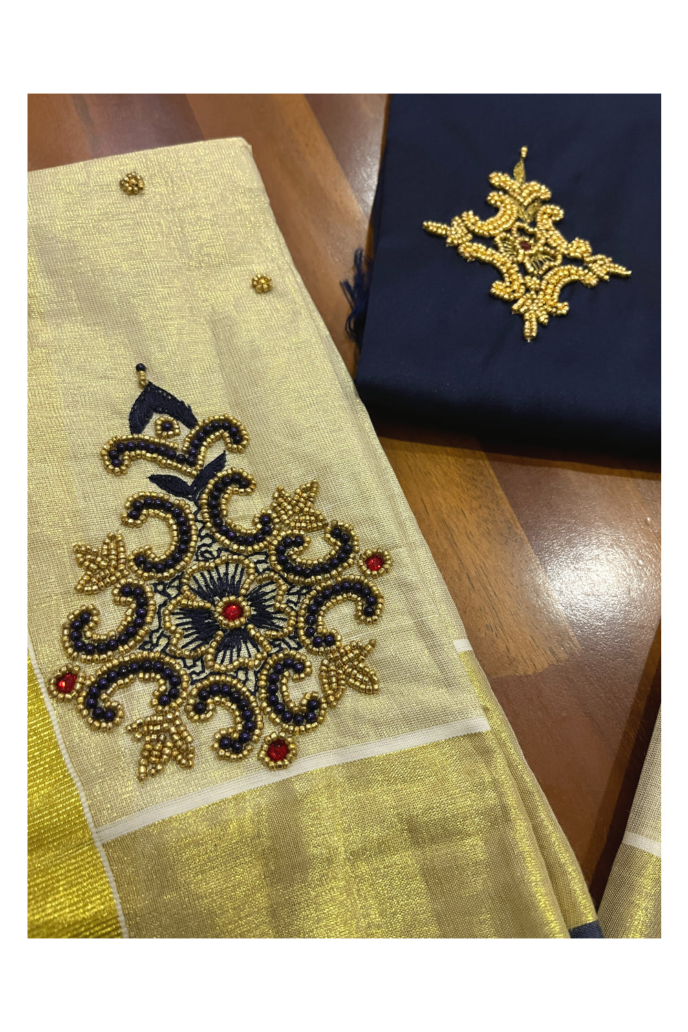 Kerala Tissue Kasavu Set Mundu (Mundum Neriyathum) with Handwork Design and Dark Blue Blouse Piece