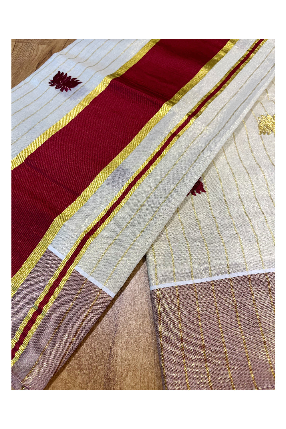 Kerala Tissue Kasavu Lines Saree with Maroon And Golden Lotus Embroidery Works