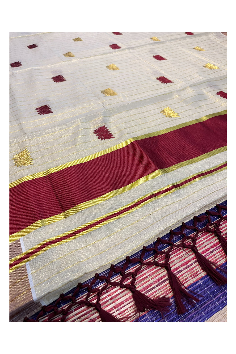 Kerala Tissue Kasavu Lines Saree with Maroon And Golden Lotus Embroidery Works