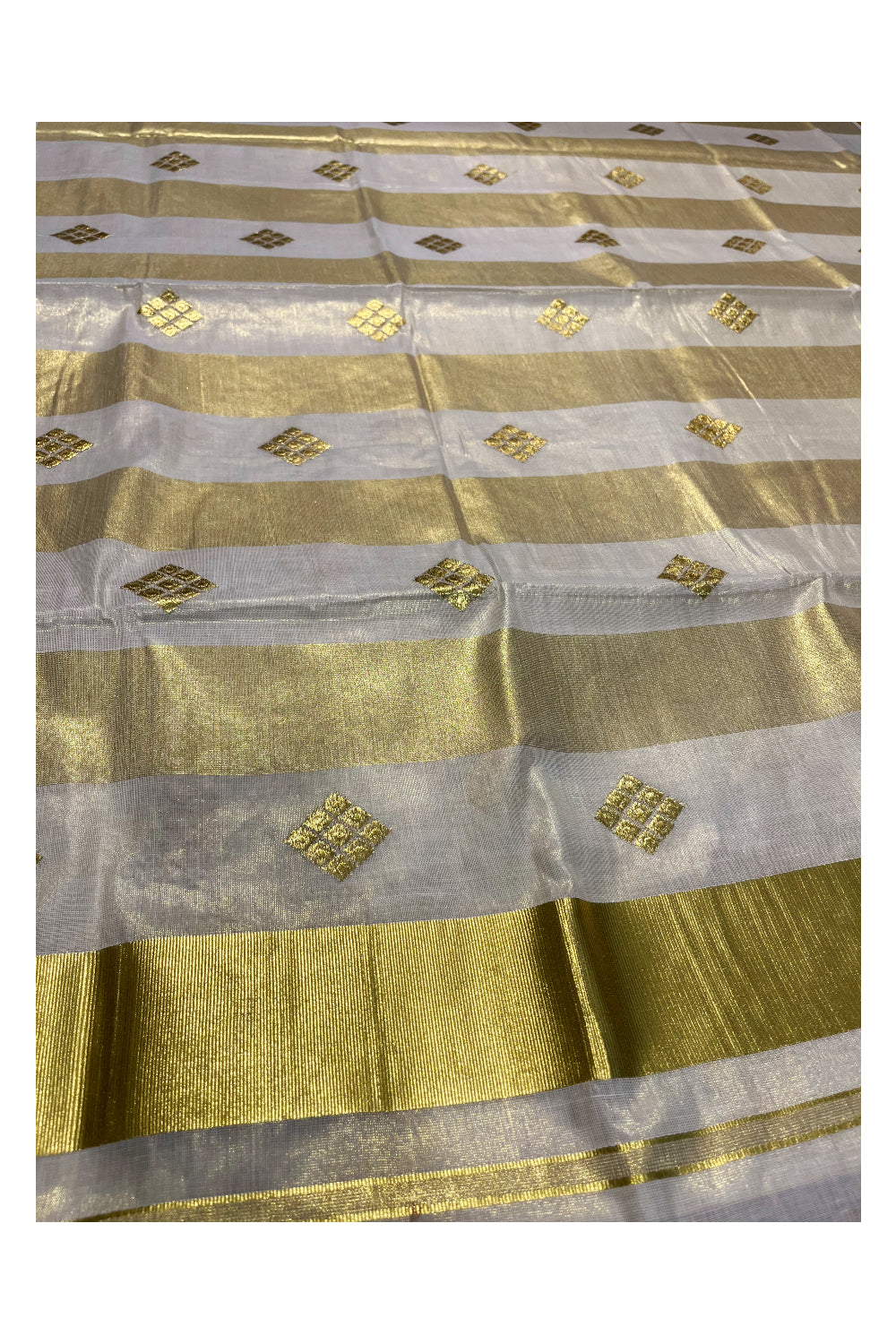 Kerala Tissue Kasavu Stripes Saree with Golden Embroidery Designs on Body and Pallu