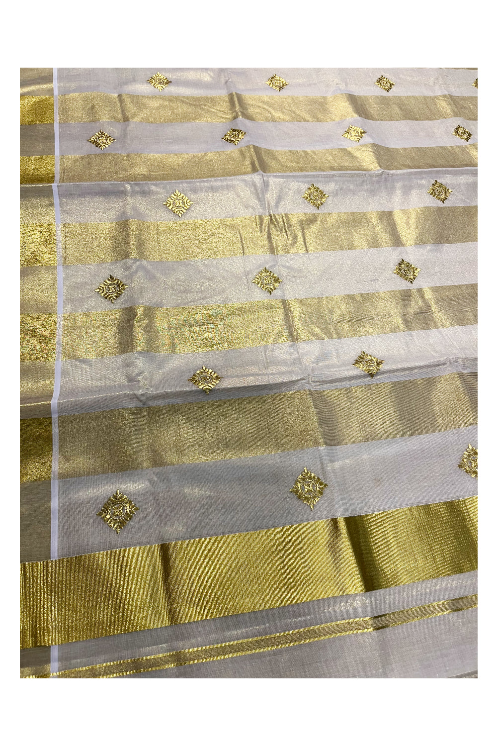 Kerala Tissue Kasavu Stripes Saree with Golden Floral Embroidery Designs on Body and Pallu