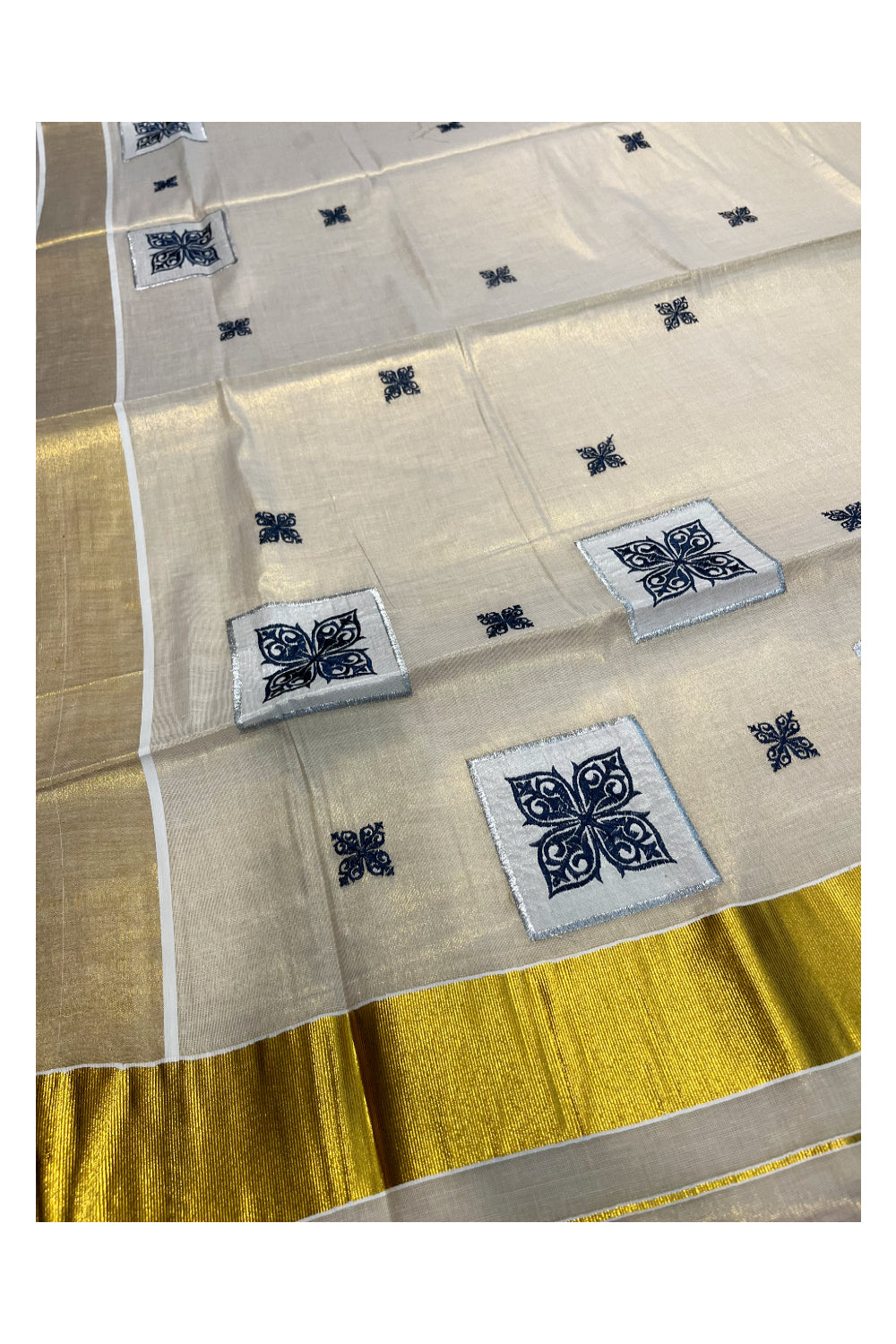 Southloom Kerala Tissue Kasavu Saree with Blue Appliq Work