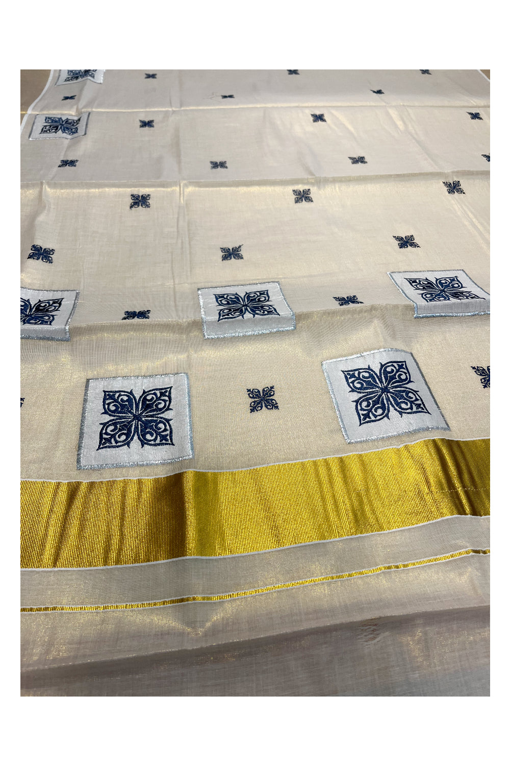 Southloom Kerala Tissue Kasavu Saree with Blue Appliq Work