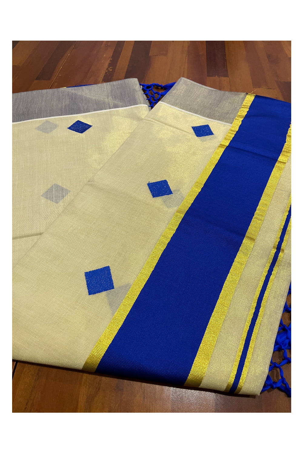 Kerala Tissue Kasavu Saree with Blue Woven Butta Designs and Tassels Works