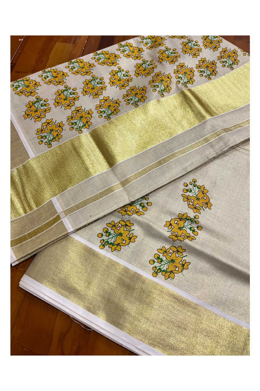Kerala Tissue Kasavu Saree with Floral Prints on Body and Kasavu Border