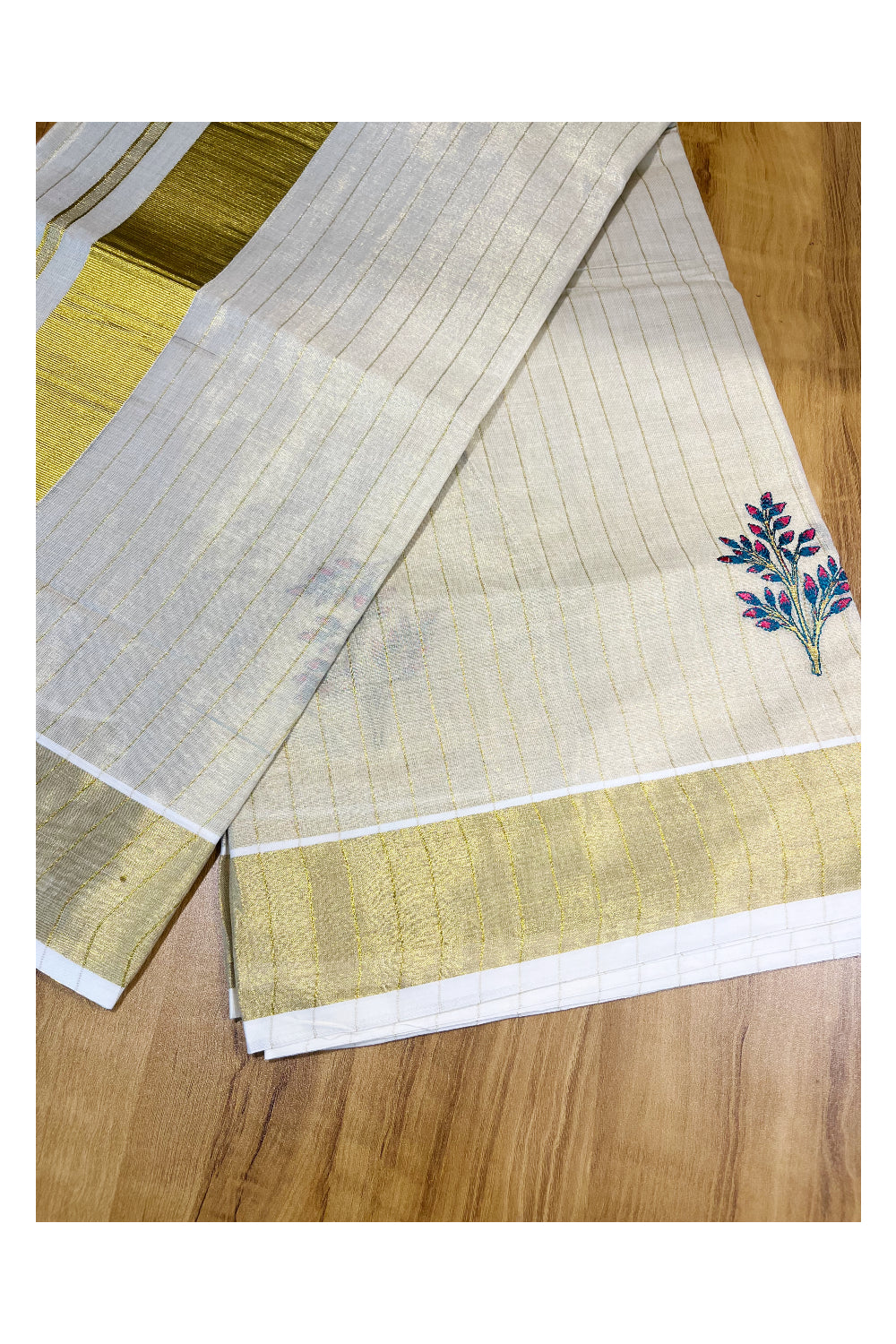 Kerala Tissue Kasavu Lines Saree with Pink and Blue Floral Embroidery Works