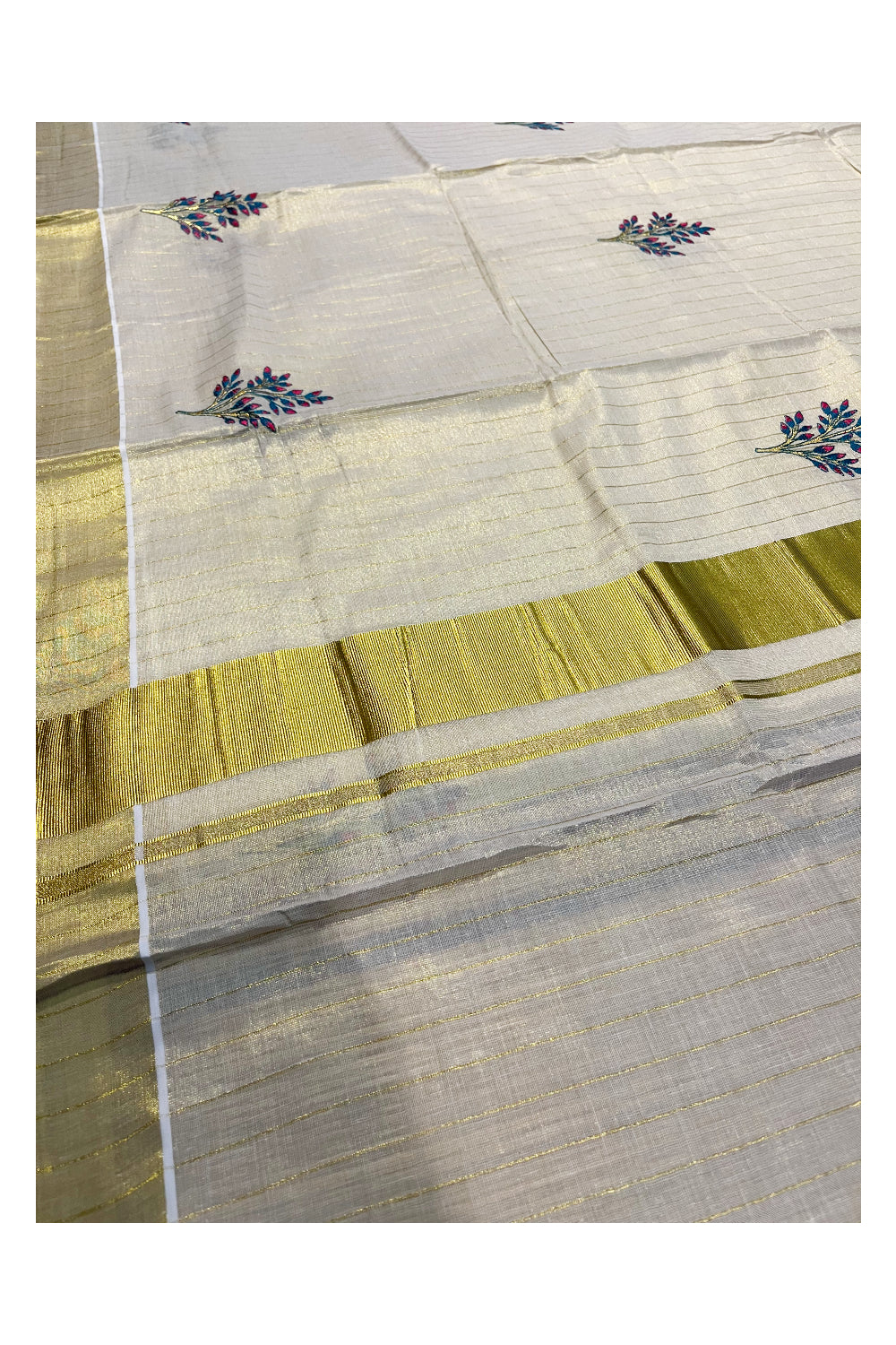 Kerala Tissue Kasavu Lines Saree with Pink and Blue Floral Embroidery Works