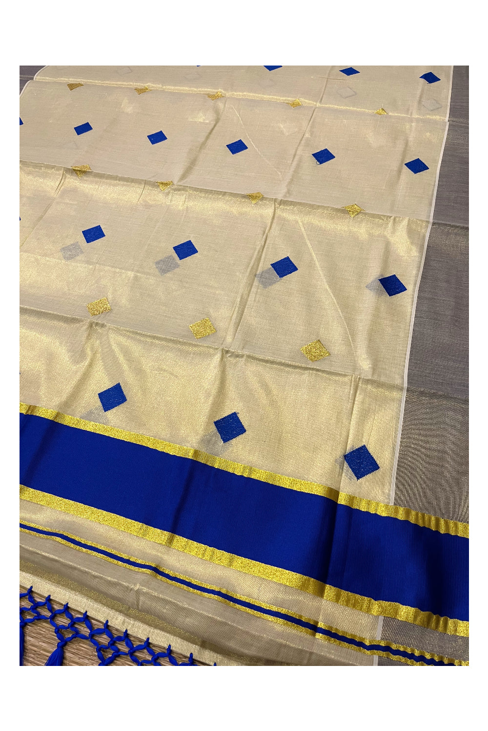 Kerala Tissue Kasavu Saree with Blue Woven Butta Designs and Tassels Works