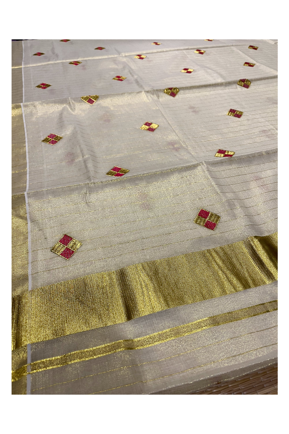 Kerala Tissue Kasavu Stripes Saree with Pink and Golden Diagonal Floral Embroidery Design on Body